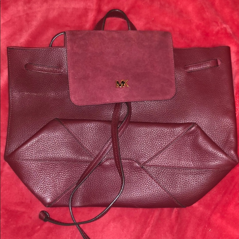 Micheal Kors maroon backpack purse